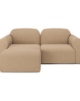 The Ethnicraft Bulky Modular Sofa - Light Sepia is a modern, cozy piece with rounded edges, low padded armrests, and a chaise lounge on the left. Its soft, smooth upholstery in light sepia ensures luxurious comfort.