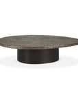 The Ethnicraft Slice Coffee Table features a textured, dark wooden top and a smooth, cylindrical black base set against a white background, showcasing classic European refinement.