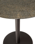 Close-up of the Ethnicraft Blend Dining Table - Ray Whisky featuring a round, mosaic-style bronze and gold top, interchangeable surfaces, and a central black metal pedestal—perfect for modern commercial spaces. White background.