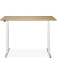 The Ethnicraft Bok Adjustable Desk - Oak features a modern oak tabletop, adjustable white metal legs, and built-in cable management, shown on a plain white background.