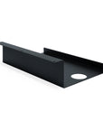 The Ethnicraft Metal Cable Tray is a black metal bracket with a flat base, vertical side panel, horizontal ledge, and a circular cutout on the right—ideal for under-desk cable organization and shown against a white background.