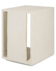 The Elements Bedside Table by Ethnicraft is a modern, rectangular off-white side table in tactile microcement with a textured surface and two vertical rectangular cutouts on opposite sides.