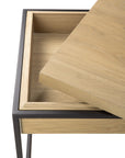 The Monolit Side Table - Oak and Black by Ethnicraft features solid oak, a removable lid with hidden storage, and a slim black metal frame.