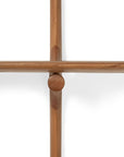A close-up, top-down view of two intersecting mahogany rods from the Ethnicraft PI Wall Shelf (3 shelves) forming a cross shape against a white background.
