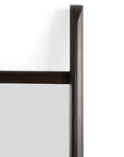 Close-up of the top right corner of the rectangular Pi Floor Mirror - Wide by Ethnicraft, featuring a dark wooden frame with a smooth handcrafted finish and sharp edges, set against a plain white background.