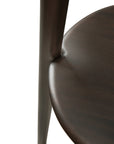 Close-up of the Ethnicraft Pi Coat Stand in mahogany, highlighting the smooth curved form and polished dark brown stained wood grain that showcase the brand’s craftsmanship.