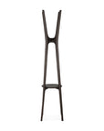 The Pi Coat Stand - Mahogany by Ethnicraft features a modern dark brown finish, three tall Y-shaped legs that curve upward and outward, all anchored by a circular base.