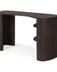 The Ethnicraft Roller Max Desk is a modern mahogany piece with curved edges, vertical grooves, two side shelves, and an open space beneath.