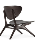 The Ethnicraft Eye Lounge Chair - Mahogany features a sculpted, curved backrest and seat with smooth, organic lines and angled legs. Its minimalist design showcases contemporary style and European refinement.