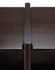 Close-up of the Ethnicraft Mortise Rack, featuring an heirloom-quality dark wood furniture joint with a vertical support piece fitted between two horizontal surfaces.