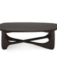The Ethnicraft PI Coffee Table in stained mahogany features a smooth pebble-shaped top and an artistic, interlocking sculptural base, combining modern design with elegant curved lines.