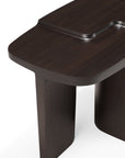 The Ethnicraft Brutalist Side Table is a modern, solid mahogany piece with a smooth rectangular top, raised curved detail, and sturdy legs—an elegant nod to Brutalist furniture design.