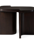 The Ethnicraft Brutalist Side Table features a sculptural, asymmetrical design in dark mahogany wood with smooth curves and sharp angles, shown against a white background.