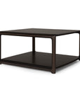 Square Eda Coffee Table by Ethnicraft in dark wood, featuring a rounded frame and a convenient lower shelf.
