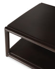 An Eda Coffee Table | Square made of dark wood with European craftsmanship, featuring a lower shelf and a rounded frame.