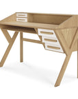 The Origami Desk - Cream by Ethnicraft features a modern design in European oak, angled legs, four white drawers per side, an open shelf above the desktop, and a natural light wood finish for classic European elegance.