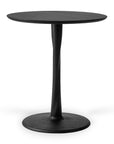 A round black side table with a smooth top, slender curved support, and circular base in black stained oak, reflecting the signature style of Ethnicraft’s Torsion Dining Table - Black Oak.