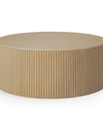 The Ethnicraft Roller Max Coffee Table - Oak is a round, solid oak piece featuring a smooth top and vertical slatted sides, shown against a white background.