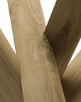 Close-up of overlapping light oak planks arranged diagonally, highlighting the natural grain and knots—just like those featured in Ethnicraft’s Mikado Side Table - Oak. The image emphasizes the texture and color of unfinished oak wood.