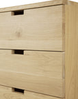 Close-up of the Ethnicraft Billy Drawer Unit - Oak, showcasing three soft-closing drawers with minimalist cut-out handles and a smooth, natural finish.
