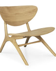 The Ethnicraft Eye Lounge Chair - Oak features a minimalist design with a curved backrest and seat, angled legs, and a light European oak finish that highlights the wood grain—modern style inspired by iconic lounge chairs.