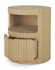 The Boomerang Drawer Unit - Oak by Ethnicraft features vertical grooves, an open upper shelf, and a curved lower drawer. Crafted from solid oak in a light finish, it offers modern minimalist style for your space.