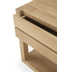Close-up of the Azur Nightstand by Ethnicraft, showcasing a minimalist design with clean lines, slatted construction, and a natural European oak hardwax oil finish.