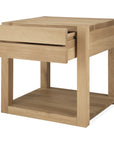 The Ethnicraft Azur Nightstand features a minimalist design in European oak, with one open drawer, a bottom shelf, and a signature hardwax oil finish.