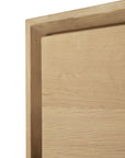 Close-up of a corner of the Nordic Dresser by Ethnicraft, made from solid European oak with a beveled edge and visible wood grain.
