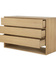 The Ethnicraft Nordic Dresser is crafted in solid European oak, featuring a minimalist rectangular design, three spacious drawers, and a flat base with open space beneath.