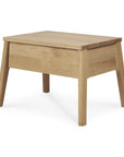 The Ethnicraft Air Nightstand is a simple, rectangular wooden piece with angled legs and a smooth finish, shown against a white background.