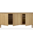 The Pi Sideboard - 3 door by Ethnicraft is crafted in solid oak with three open cabinet doors, interior shelving, a natural light wood finish, and a minimalist design.