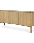 The Pi Sideboard - 3 door by Ethnicraft is crafted from solid oak, featuring clean lines and rounded corners and legs for a minimalist, modern look.