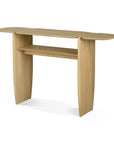 The PI Console - Oak by Ethnicraft features a solid oak tabletop with rounded ends, two vertical legs, and an open shelf. Its natural finish highlights the minimalist design, making it a standout piece for modern interiors.