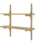 The Ethnicraft PI Wall Shelf – Oak (2 shelves) features a minimalist design with smooth, rounded edges, handcrafted with vertical supports and two horizontal shelves in a light solid oak finish.