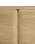 Close-up view of two solid oak panels from the Ethnicraft PI TV Cupboard, showing rounded edges and a narrow vertical gap between them against a white background.