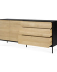The Ethnicraft Blackbird Sideboard features two doors and three European oak drawers in a sleek black frame, complemented by slim black legs.