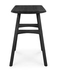 The Ethnicraft Osso Dining Stool - Black features a modern, minimalist design with a flat rectangular seat, slightly angled legs, and two horizontal supports. Photographed against a plain white background.