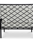The Salma Outdoor Lounge Chair by Moes features a black metal frame with a crisscross lattice backrest and white quick-dry foam cushions with white fabric ties. The chair is displayed from the back against a white background.