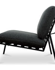Side view of the Salma Outdoor Lounge Chair by Moes, featuring a black metal frame, angled legs, and thick dark gray olefin-upholstered quick-dry foam cushions, set against a white background.