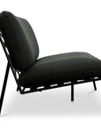 Side view of the Salma Outdoor Sofa by Moes, featuring a black metal frame and thick, dark Olefin fabric cushions on the seat and backrest, set against a white background.