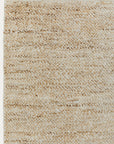 Close-up of the Armadillo&Co Acacia Rug - Fawn, showcasing its textured beige and cream weave, subtle uneven patterns, and slightly rough surface.