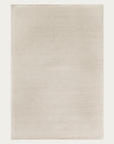 Introducing the Sherpa Rug – Sand by Armadillo&Co: a rectangular, plain light beige Fair Trade rug featuring a subtle woven texture. Expertly handwoven from wool, it’s shown here on a neutral background.