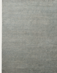 The Armadillo&Co Corsica Rug - Capri is a large rectangular rug with a subtle textured pattern in muted blue and gray, offering a minimalist design thats ideal for modern interiors. Displayed on a plain background.