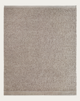 The Palus Rug - Anise by Armadillo&Co is a rectangular beige mat with a textured, absorbent surface and smooth border, inspired by sustainable design and shown on a plain background.