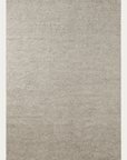 The Malawi Rug - Feather by Armadillo&Co is a rectangular, light beige woven rug with a subtle textured pattern and fringe on the short edges, featuring a minimalist, hand-knotted design crafted with care.