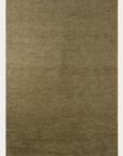 The Malawi Rug - Olive by Armadillo&Co is a square, textured brown artisanal rug with a subtle horizontal pattern and short tassels on the top and bottom edges. It offers a natural look and is crafted to Fair Trade standards.