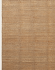 The Reed Rug - Natural by Armadillo&Co is a rectangular woven jute and wool rug in natural beige tones, with tightly braided texture and visible patterns. Its edges are straight and neatly finished.