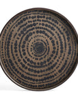 The Black Beads Wooden Tray - Round / Small by Ethnicraft features silk-screen printed wood with black dotted circles radiating from the center, giving a modern, textured update to classic tribal patterns.