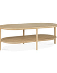 The Bok Coffee Table - Oak by Ethnicraft features an oval shape, solid oak build in a light finish, four legs, and a lower shelf for added storage.